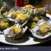 oysters-served-on-a-restaurant-inside-the-seafood-market-in-haikou-hainan-island-china-PR8C9J